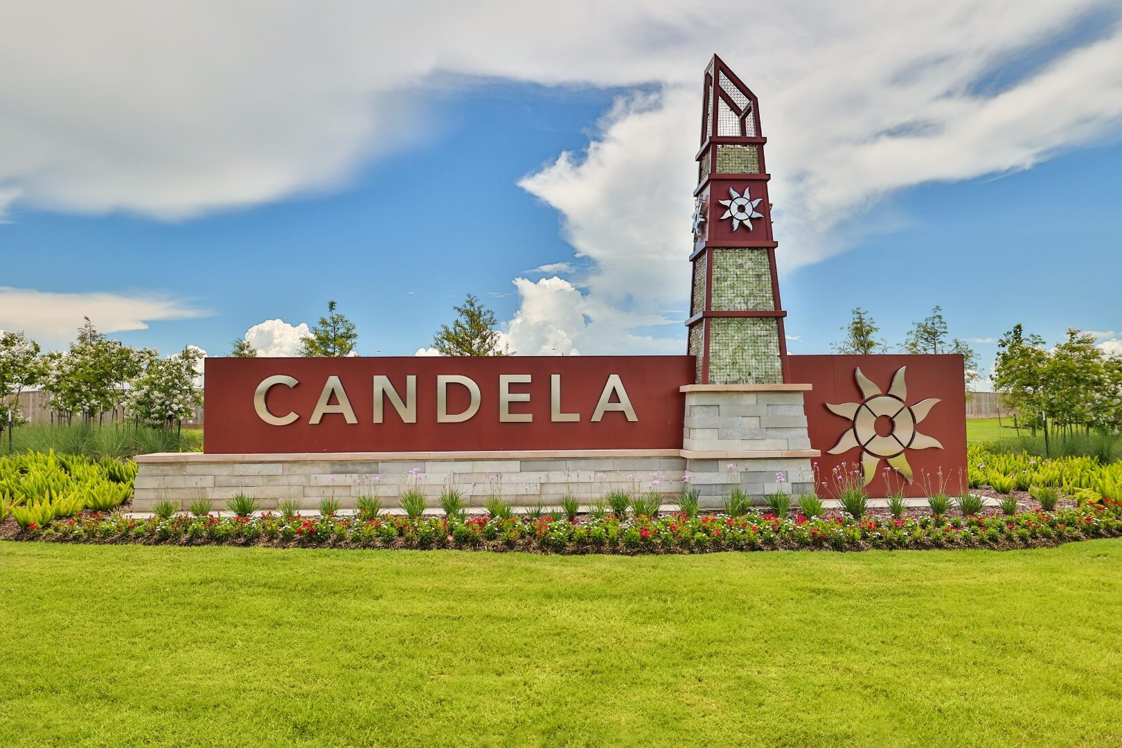 Candela community entry with metal tower and dimensional letters