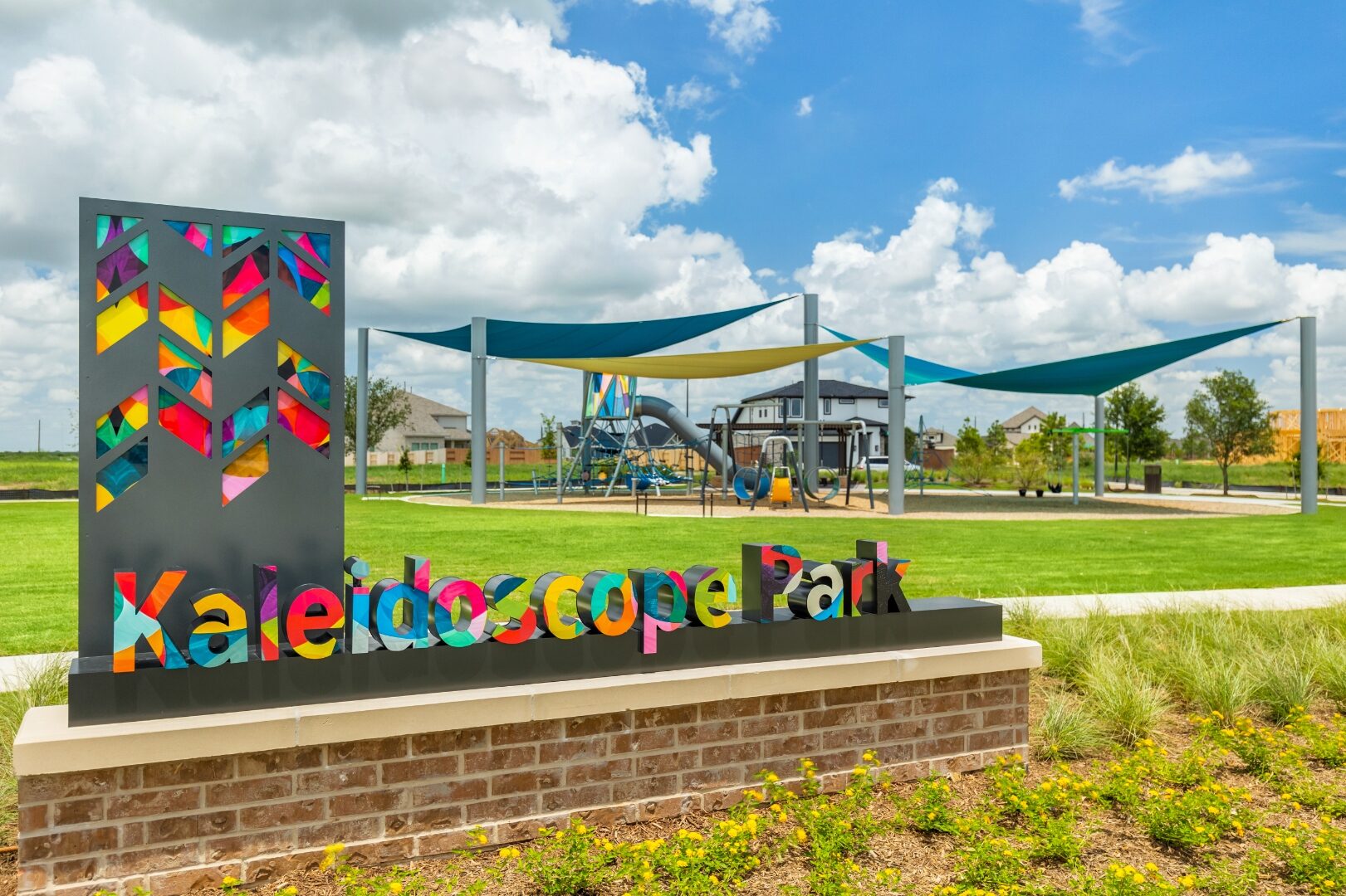 Kaleidoscope Park colorful cut-metal sign
