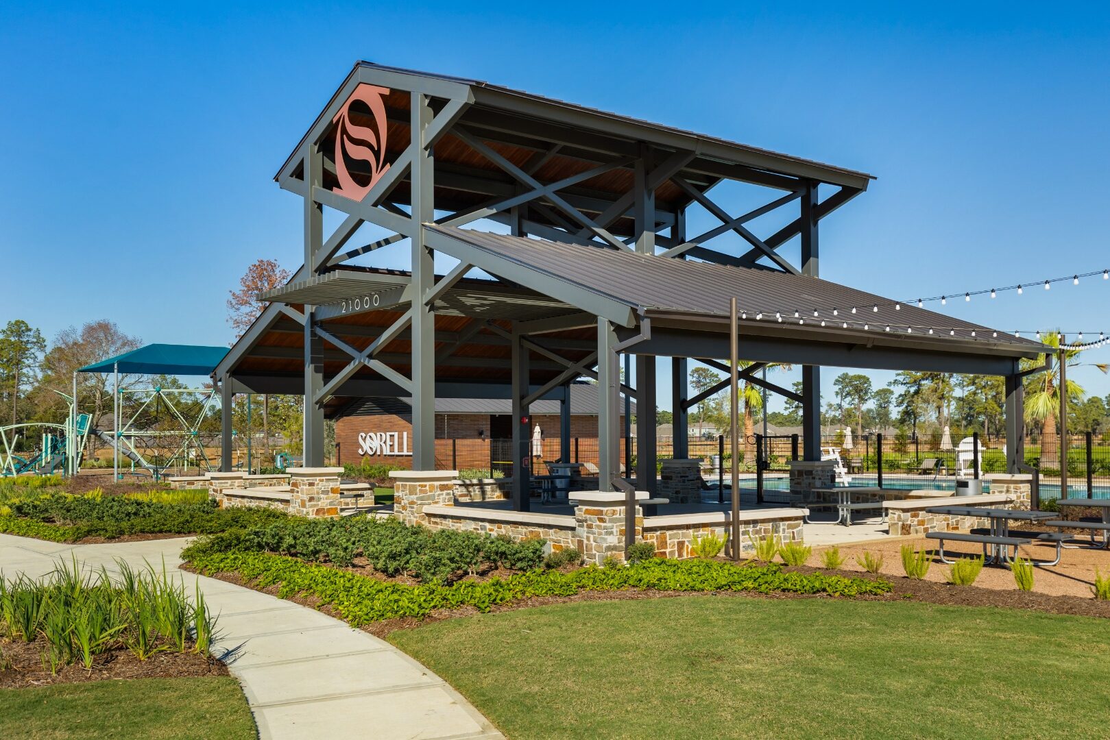 Sorella amenity entry view with dimensional SORELL letters and 21000 address numerals